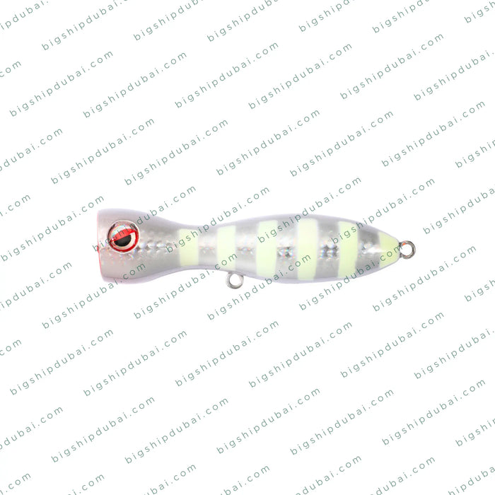 Fishing lure with a striped body and red eye on a white background